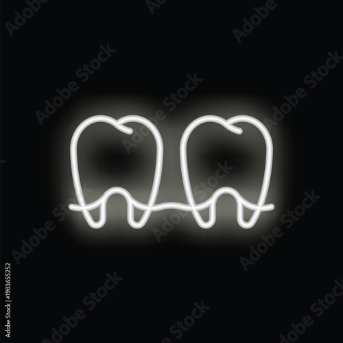 White neon sign depicting two healthy teeth glowing on a black background