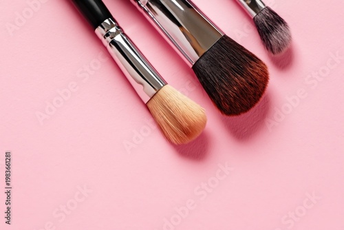 Different Types of Makeup Brushes on a Pink Background for Beauty Fans and Ar...