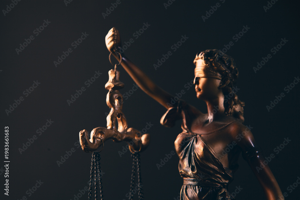 law, justice. themis of thematic statue of justice on black background.