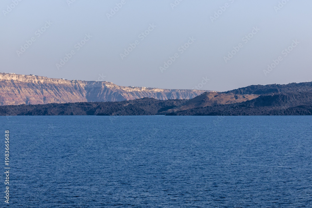 Fototapeta premium View of the volcano Palea Kameni and the Aegean Sea in Santorini Greece