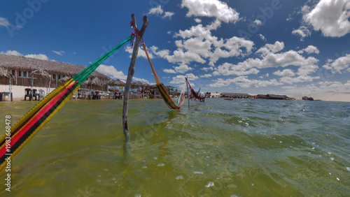 Hammocks Over Crystal Clear Water in Lagoa Azul, Jericoacoara, Brazil