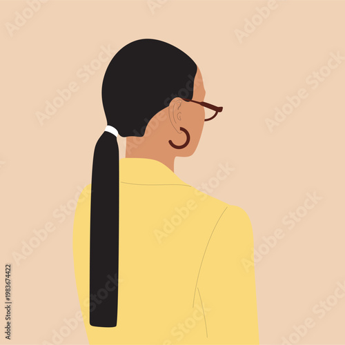 A woman in a oversized lemon-colored jacket with a long ponytail, stylish glasses and earrings. 