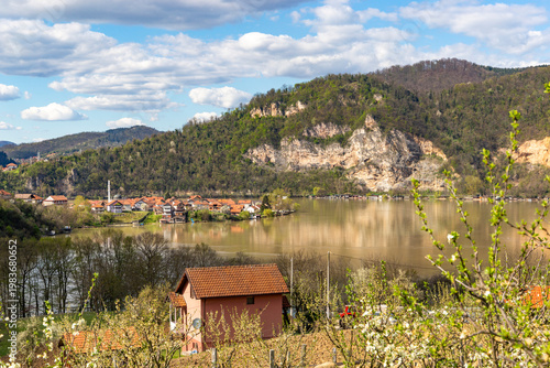Wallpaper Mural Scenic riverside settlement along the Drina River under a sunny spring sky, Serbia Torontodigital.ca