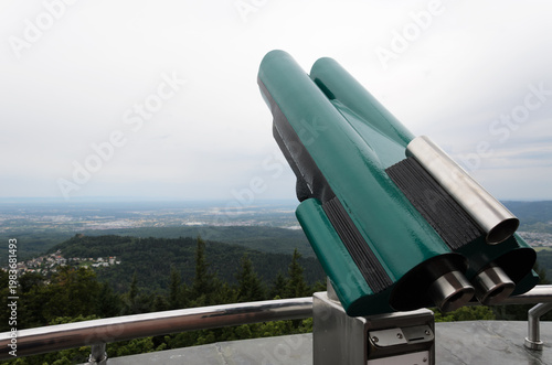 Tourist Binoculars Pointing Toward Scenic Valley View