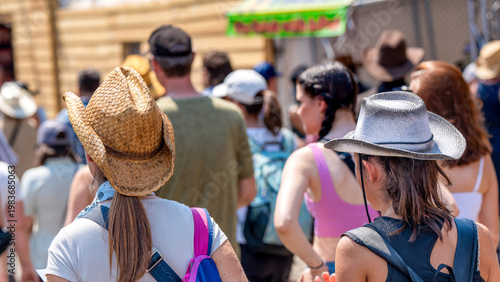 Tableau sur toile Calgary, Alberta - July 10, 2024: Group of people walking along Stampede Park