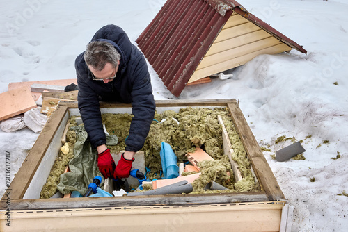 Distribution manifold with service lines in well pit homeowner installs HDPE piping using compression fittings.