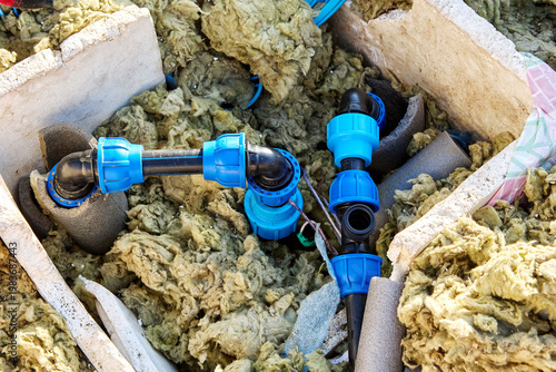 HDPE piping in artesian well pit during renovation.