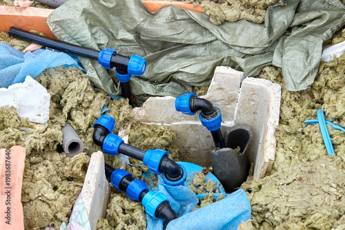 Well pit distribution piping in well under repair.