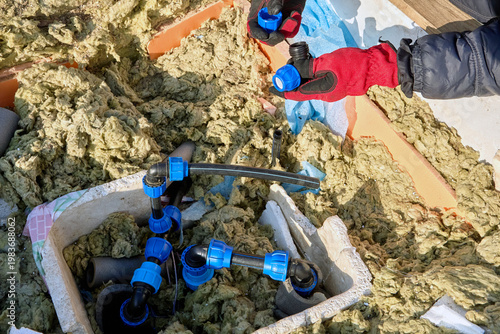 Repair of water supply system of HDPE pipes in artesian well pit.