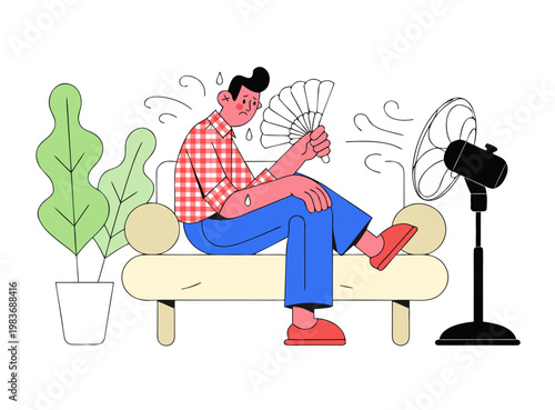 Man sitting on couch fanning himself with handheld fan next to standing fan