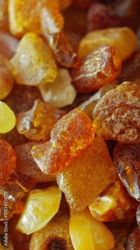 Macro texture of rotating amber pieces
