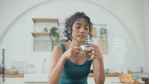 Wallpaper Mural Holiday concept of 4k Resolution. Asian woman drinking morning coffee in the kitchen. Torontodigital.ca