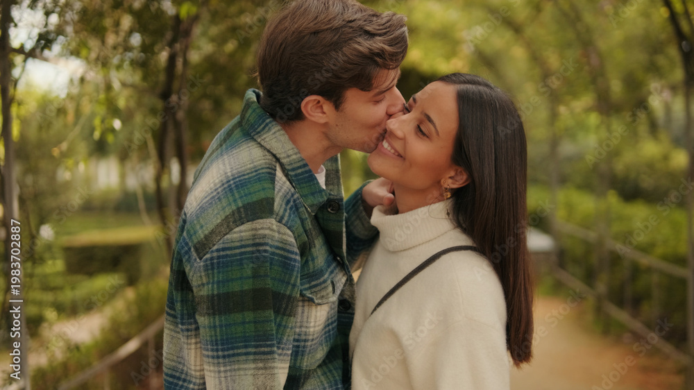 Fototapeta premium Romantic Couple Kissing In Park Outdoors Moment