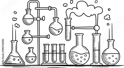 Set of glass laboratory equipment for scientific experiments including flasks and test tubes with bubbling liquid