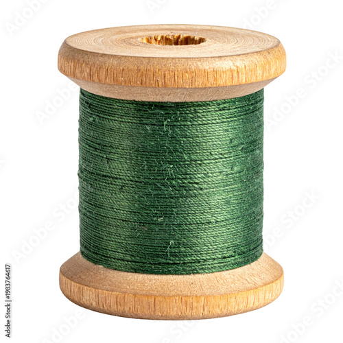 Wooden spool of vibrant green sewing thread in a closeup studio shot; traditional crafting material on a black isolated background