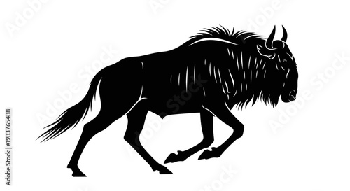 Silhouette of a running wildebeest animal with horns and mane