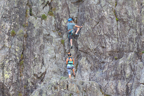 Chamonix-Mont-Blanc, Haute Savoie, France - August 09th, 2025: People climbing Les Gaillands rock, a traditional sporting activity maintained by the Compagnie des Guides de Chamonix.