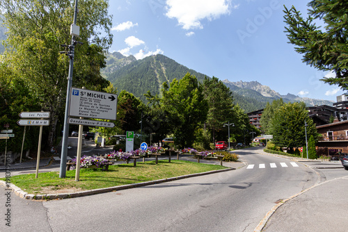 Chamonix-Mont-Blanc, Haute Savoie, France - August 09th, 2025: Signs indicating directions on the Route des Pecles with the Le Brevent mountains in the background.