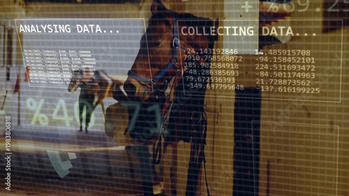 Stable worker walking down barn aisle while horse in stall wearing halter, HUD overlays appearing