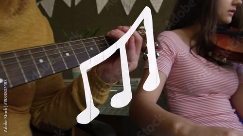 Vertical video: Teen musicians playing guitar violin wind, strumming causing note graphic in class