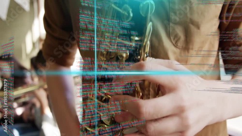 Vertical video: Teen sax playing in music class, camera pull sparking blue code overlay across keys