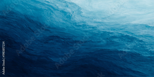 A calm blue water surface ripples under a summer sky where the ocean horizon meets soft clouds in a serene nature landscape