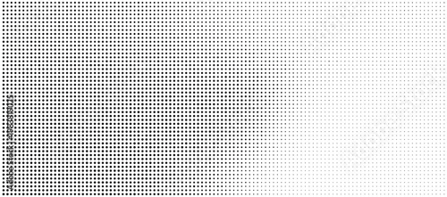 Halftone dots pattern with gradient effect on white background
