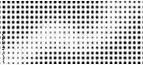 Halftone dots pattern with gradient effect on white background
