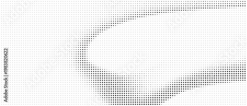 Abstract pattern of black dots forming a partial circle with negative space abstract background halftone pointillism