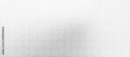 Halftone pattern with small black dots on a white background gradient
