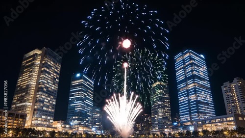 Spectacular Fireworks Display Over Illuminated City Skyline at Night.