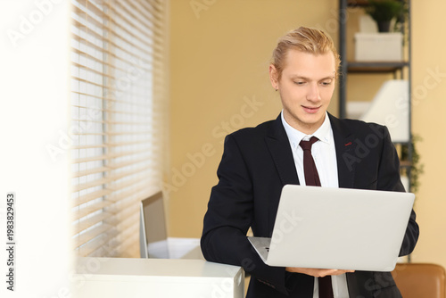 Young businessman working w...