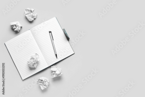 Notebook and crumpled piece...