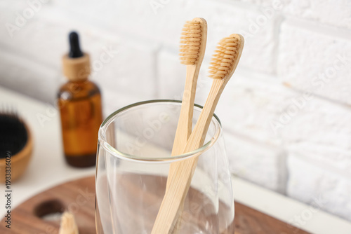 Glass cup with toothbrushes...