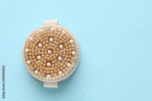 Massage body brush on blue ...