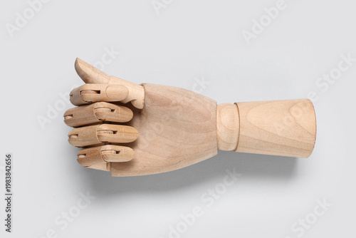 Wooden hand with clenched f...