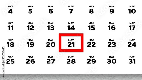 The date May 21st marked with a red cursor on the wall calendar 2026