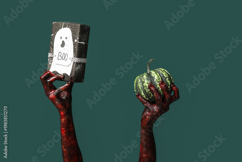 Hands of zombie with gift b...
