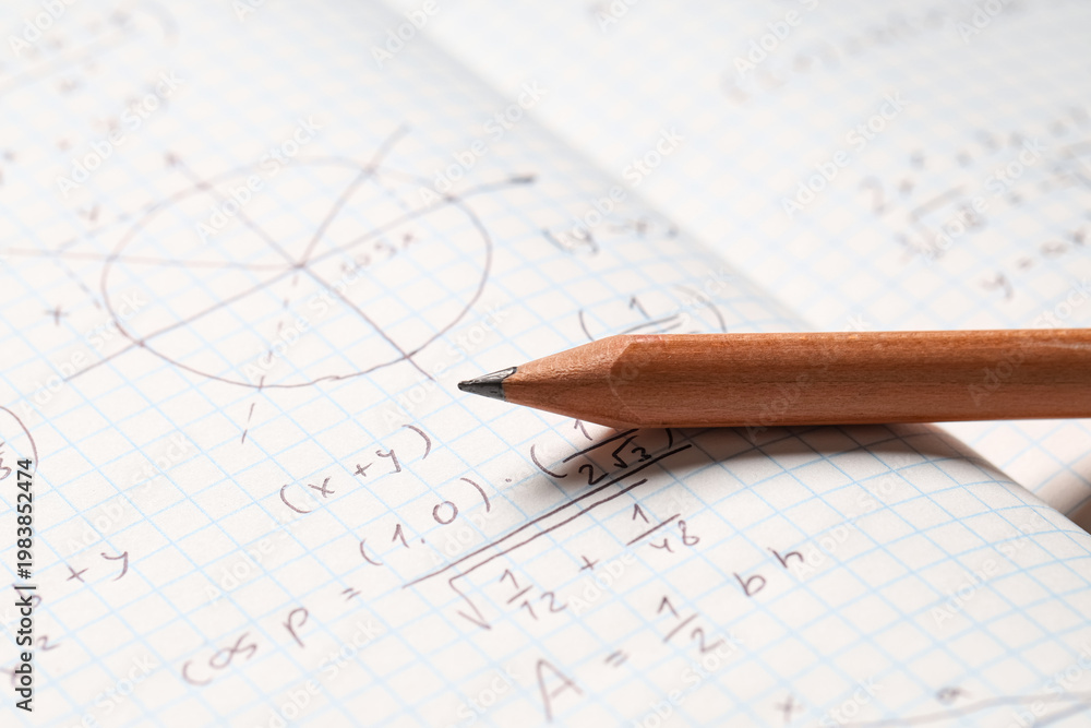 Fototapeta premium Copybook with handwritten maths formulas and pencil as background, closeup