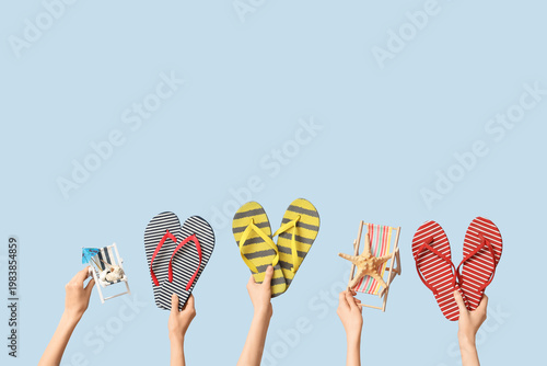 Hands holding three pairs o...