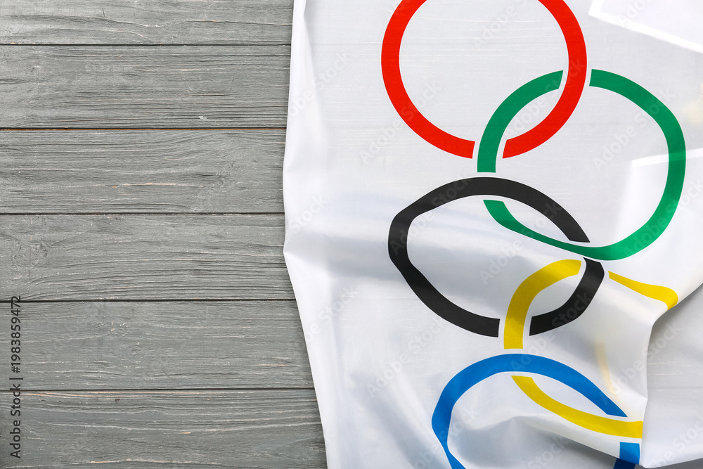 Obraz premium Olympic flag on grey wooden background