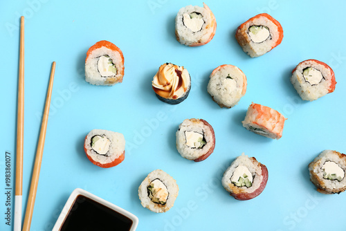 Tasty sushi rolls with chop...