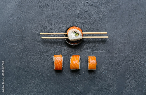 Tasty sushi rolls with chop...