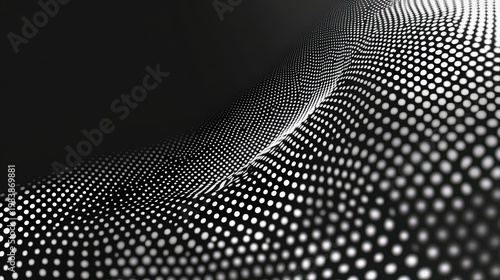 A black and white image of a wavy surface made up of small dots