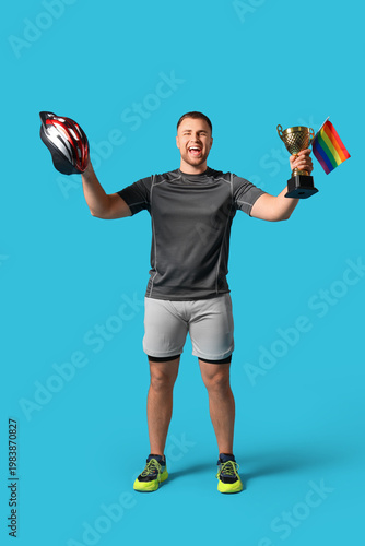 Male cyclist with gold cup ...