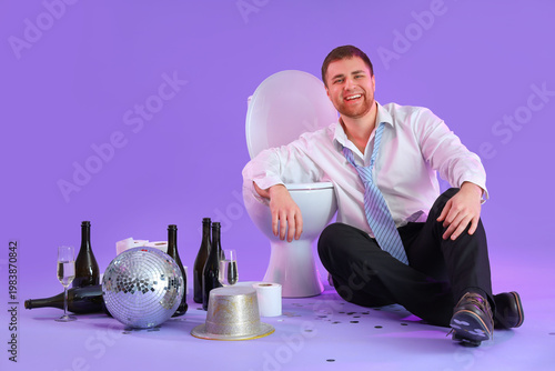 Drunk young businessman sit...