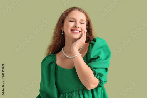 Smiling young redhead woman...