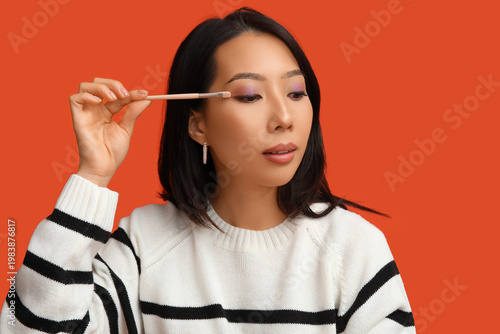 Young Asian woman with make...