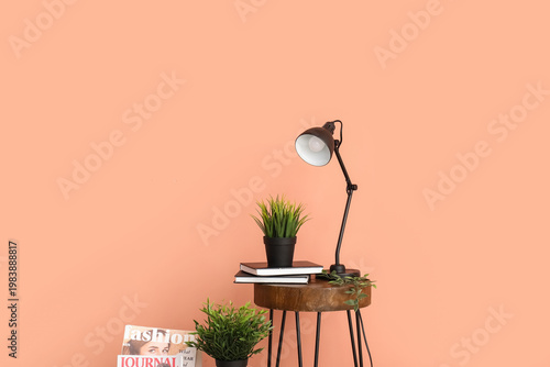 Desk lamp and houseplant on...