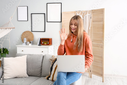 Teenage girl with laptop vi...
